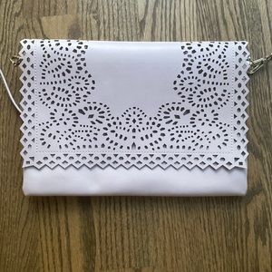 Moda Luxe Pink Clutch with strap.  Carried one time.  Nonsmoker